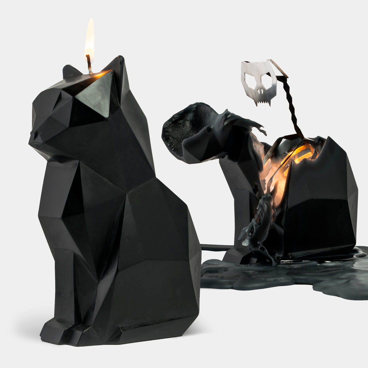 PyroPet Kisa black cat candle beside the same candle burned down to its metal skeleton
