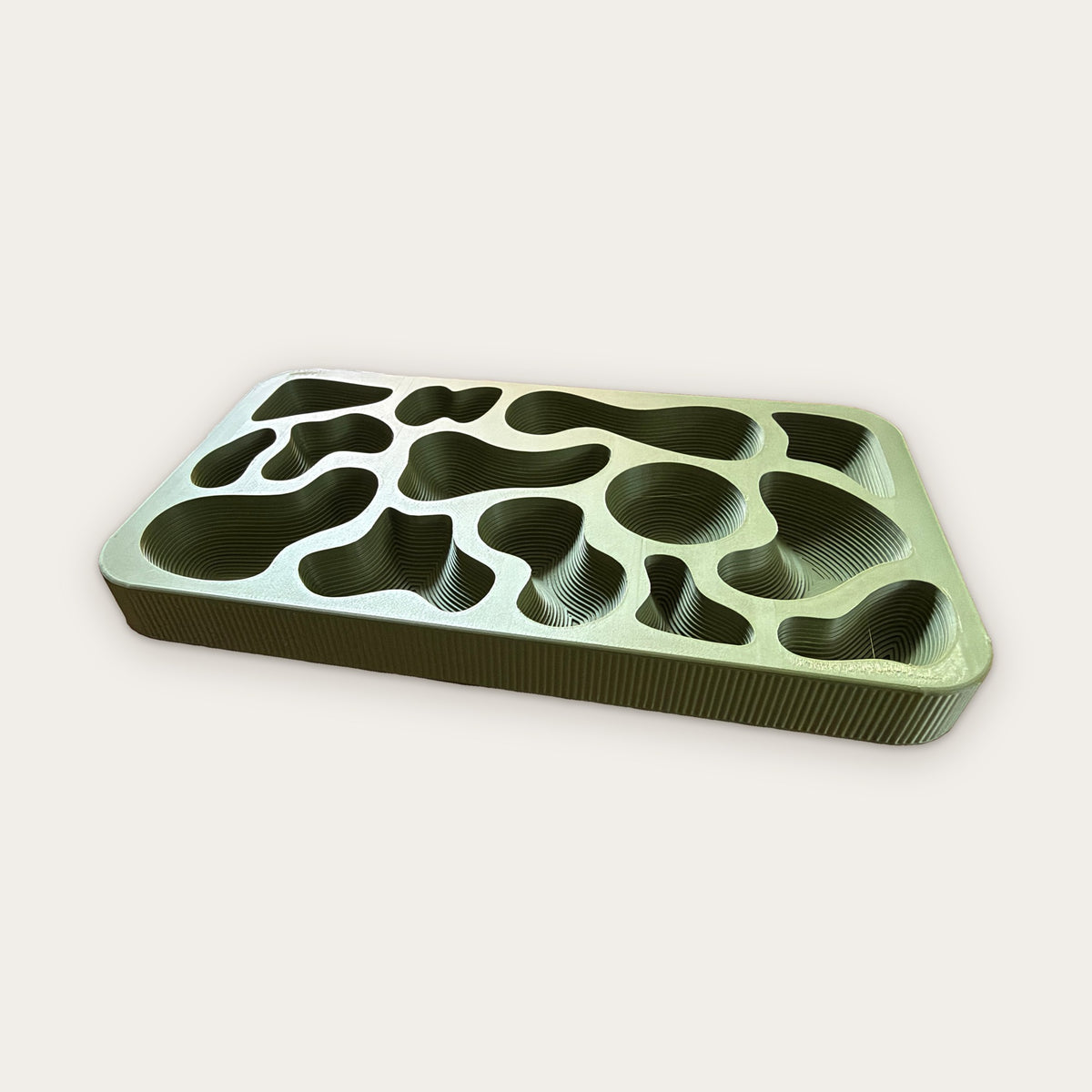 Moss green 3D printed tray with organic terraced wells and fluted sides, by HATCHBACK