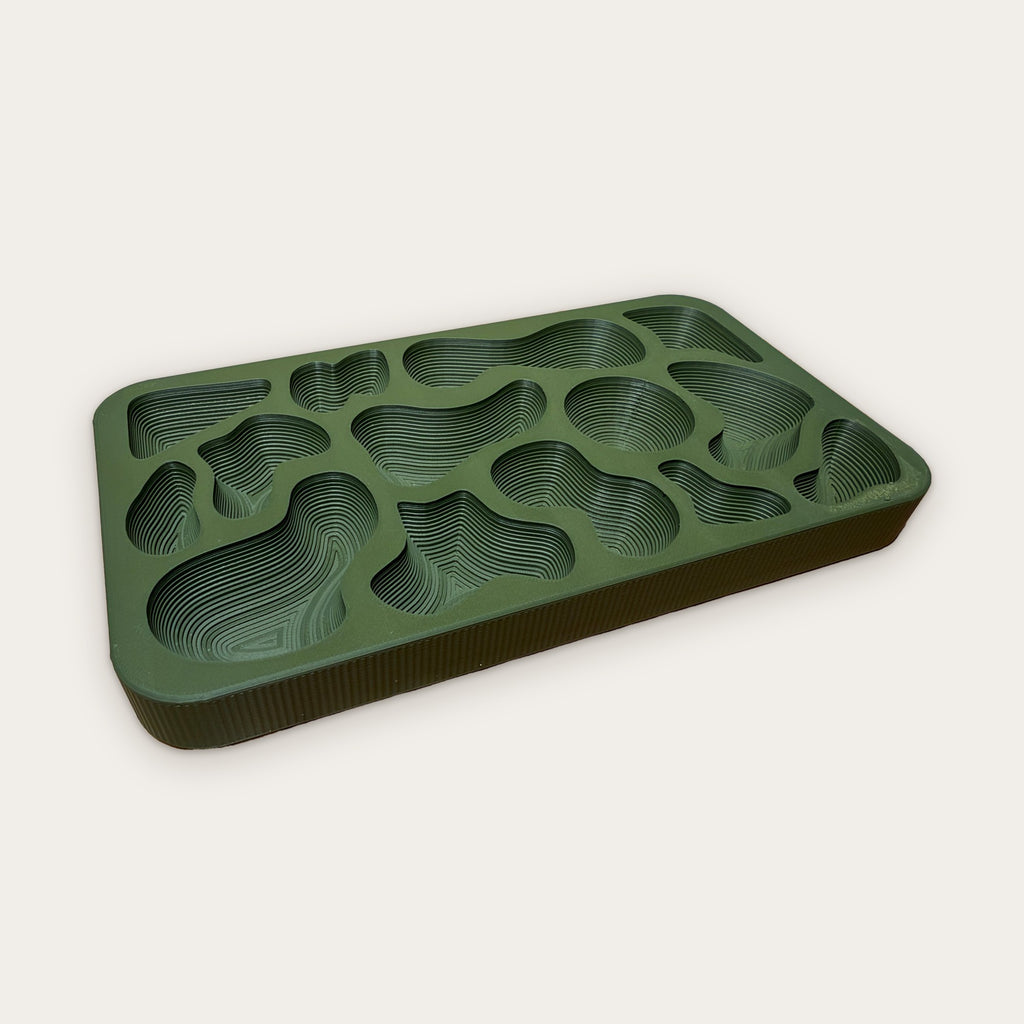 Topography Tray at an angle, showing the contour line layers inside each well