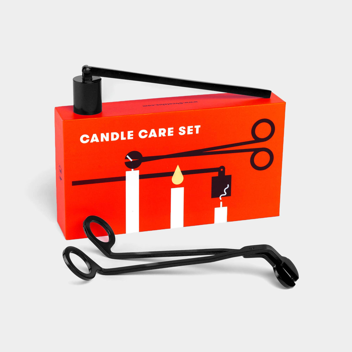 Candle Care Set in its red box with the black snuffer and wick trimmer laid out in front