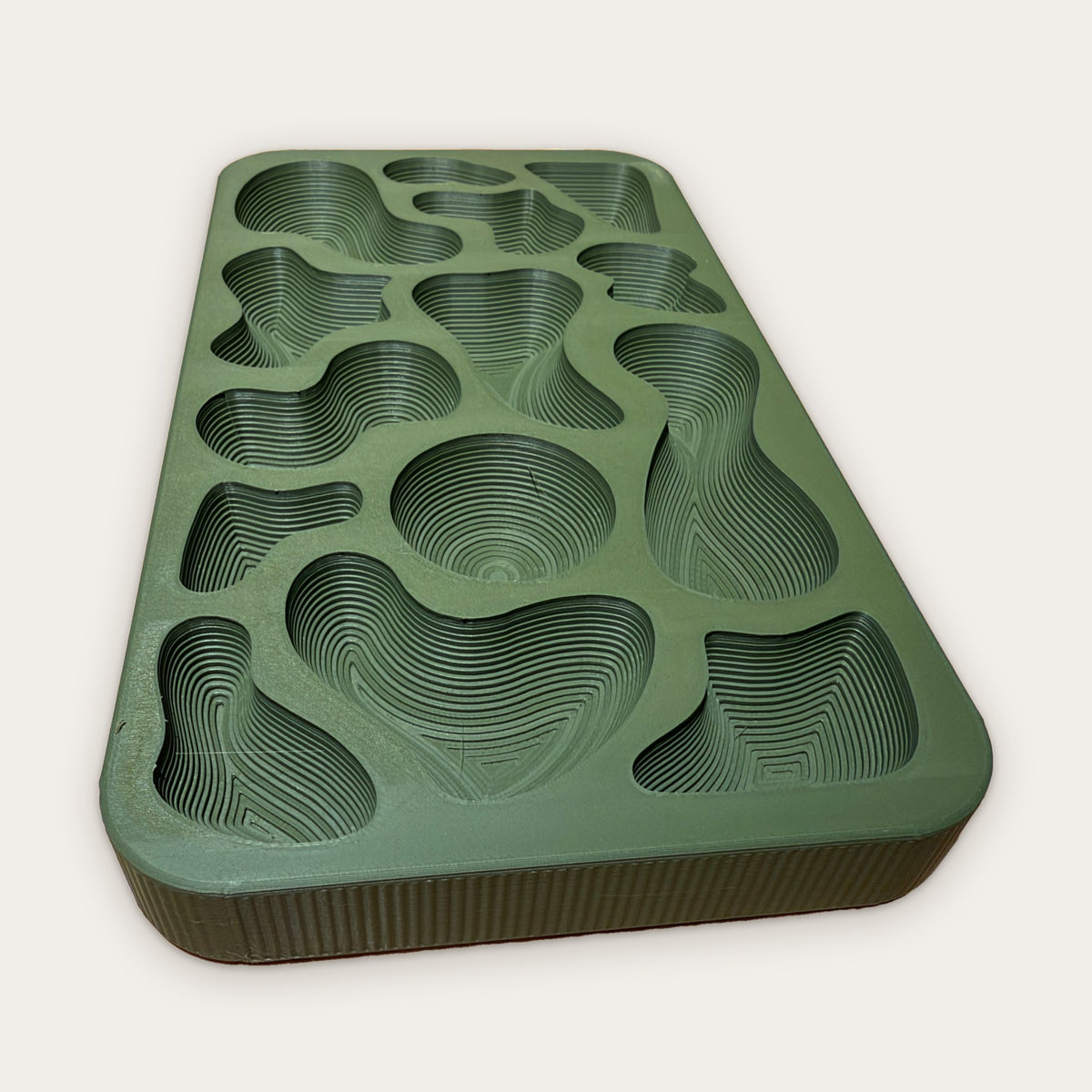 Close view of the Topography Tray wells, stepped like a topographic map
