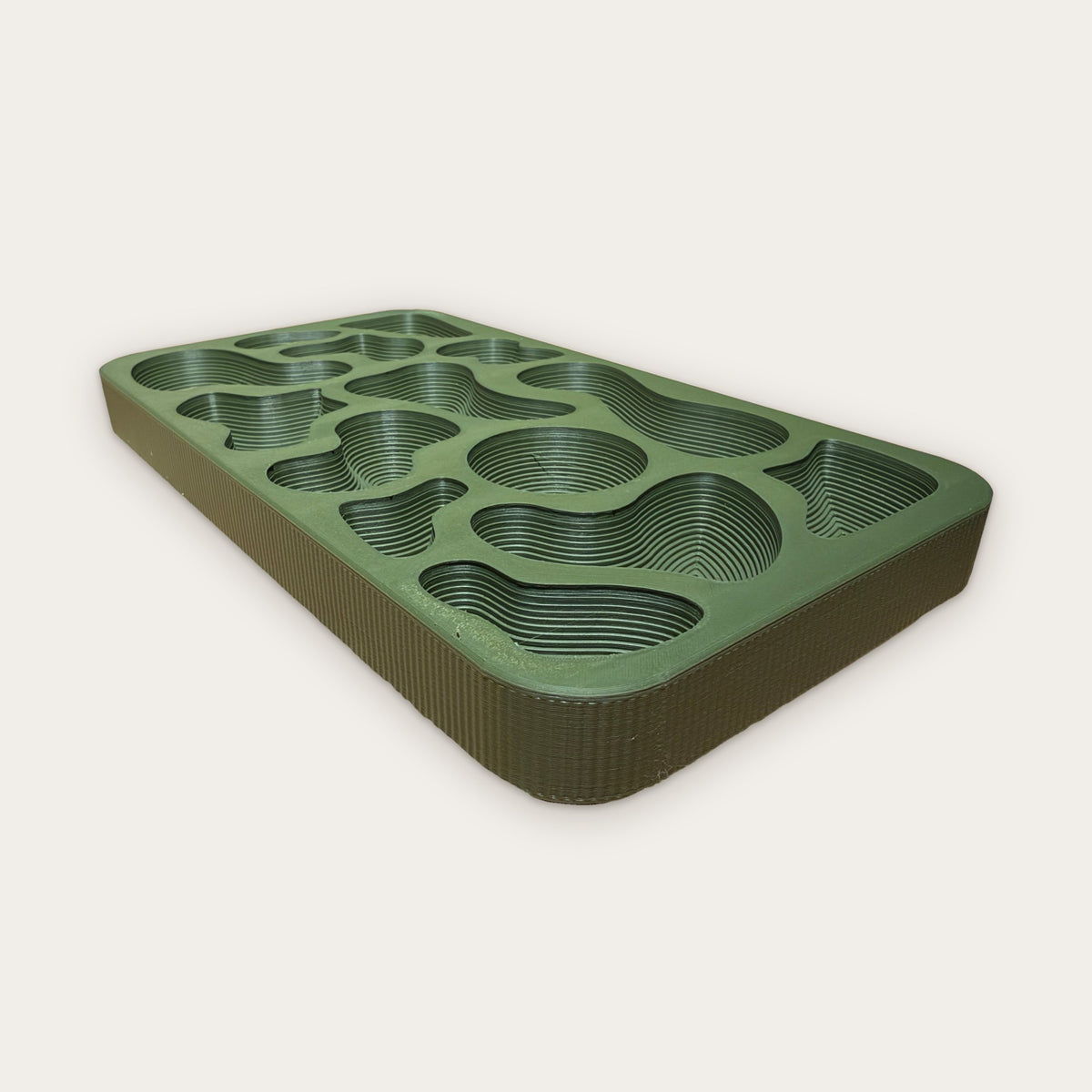Fluted outer wall of the moss green Topography Tray