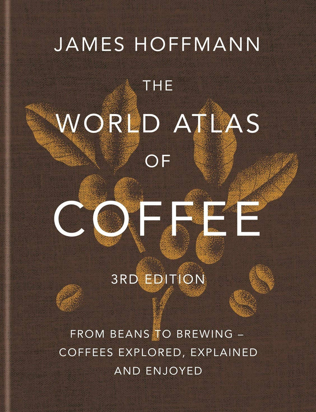 The World Atlas of Coffee cover: dark brown linen with gold lettering and a small gold illustration of a coffee branch