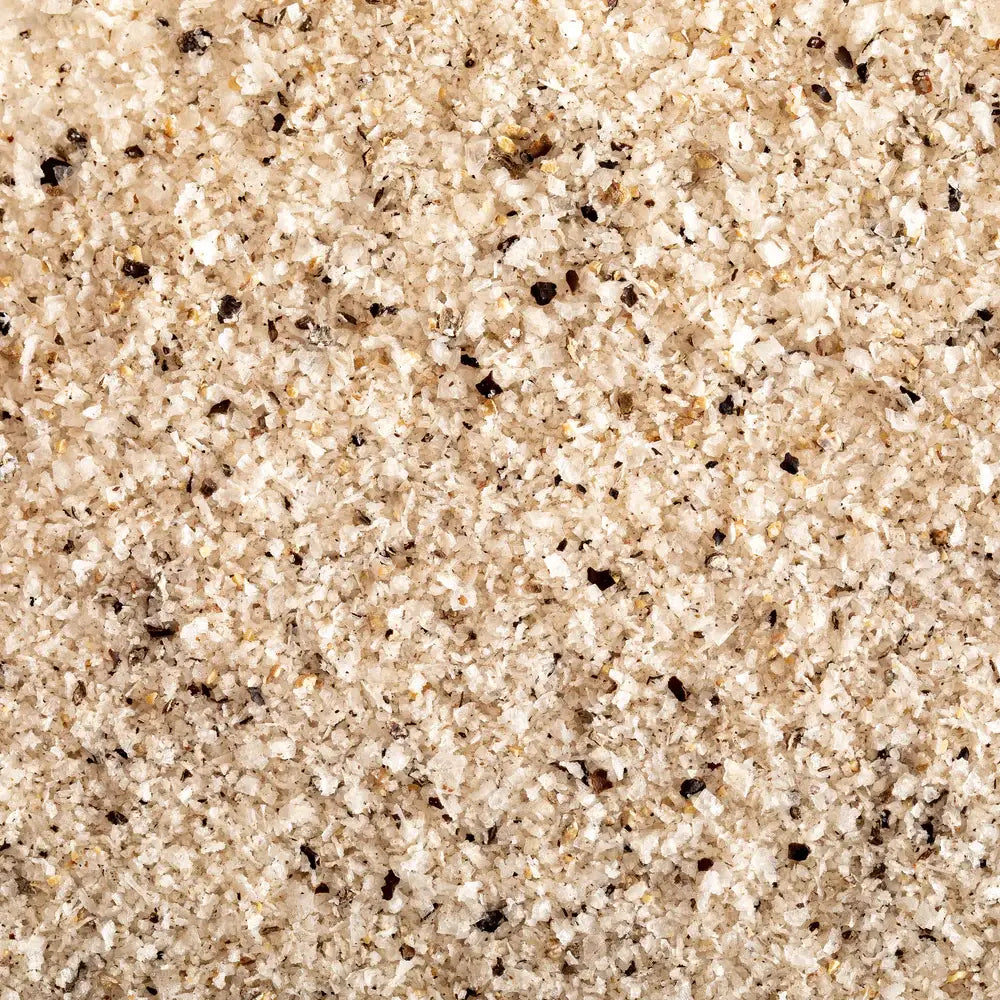Close up of Jacobsen black pepper salt, white sea salt crystals flecked with ground pepper