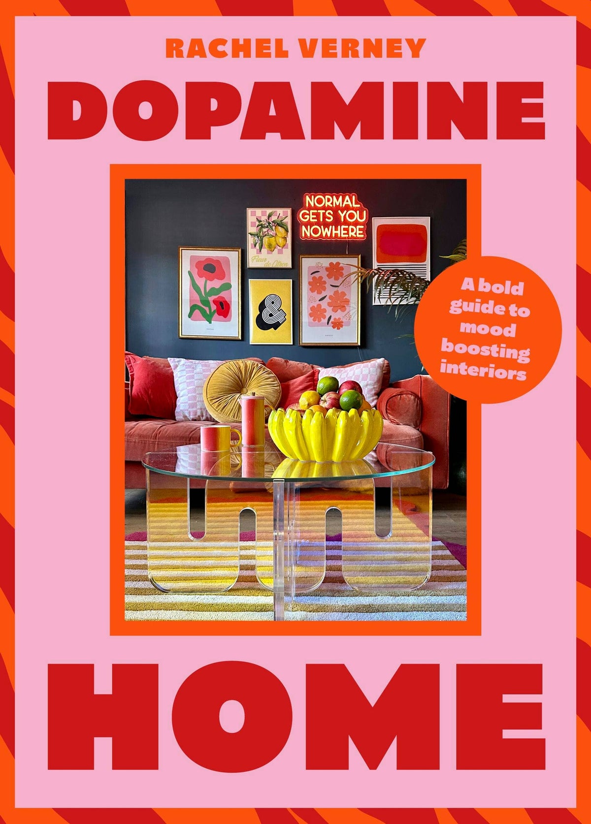 Dopamine Home hardcover, a hot pink cover framing a photograph of a bright living room with a red sofa and a yellow bowl of bananas