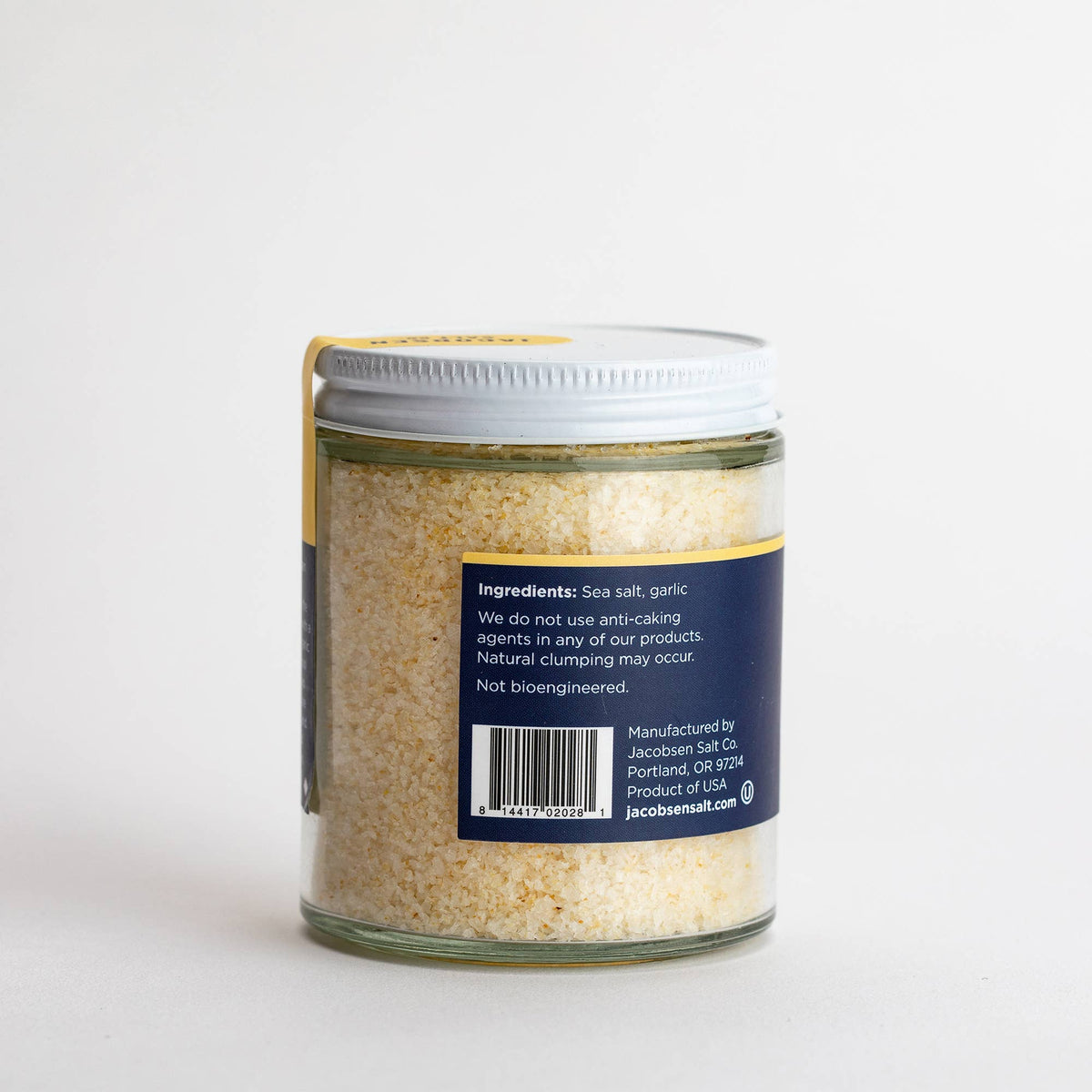 Back of the Jacobsen Garlic Salt jar showing the ingredients label, sea salt and garlic