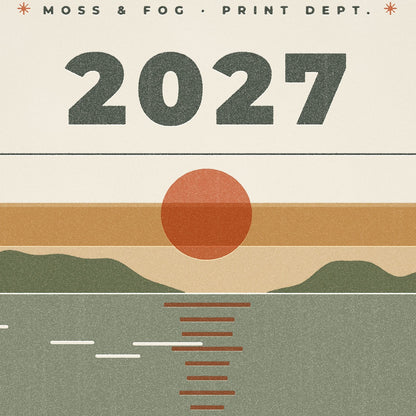 Close-up of the 2027 Moss and Fog calendar cover showing worn press type and paper grain