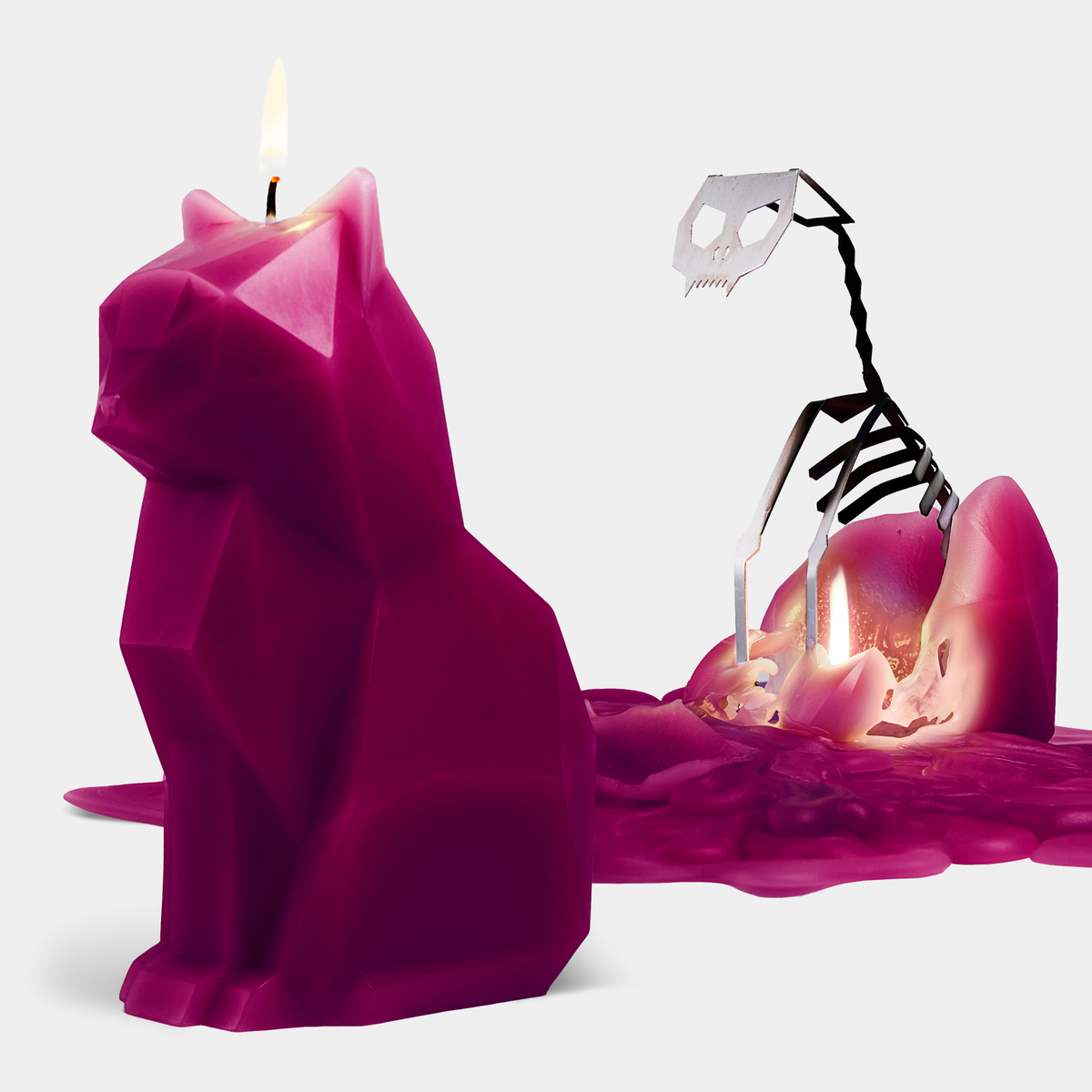 PyroPet Kisa candle, a faceted burgundy cat shaped candle with a hidden aluminum skeleton