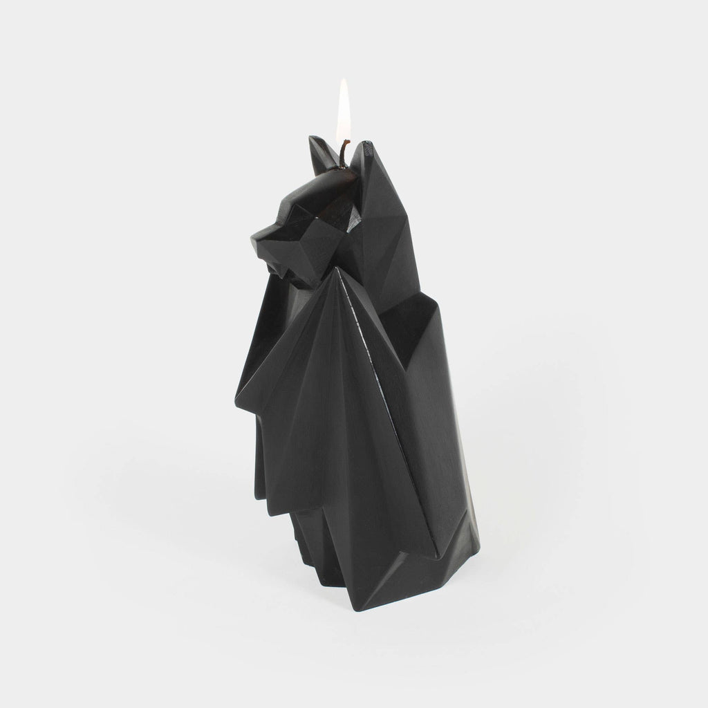 Blaka bat candle unlit, a faceted black wax sculpture with folded wings