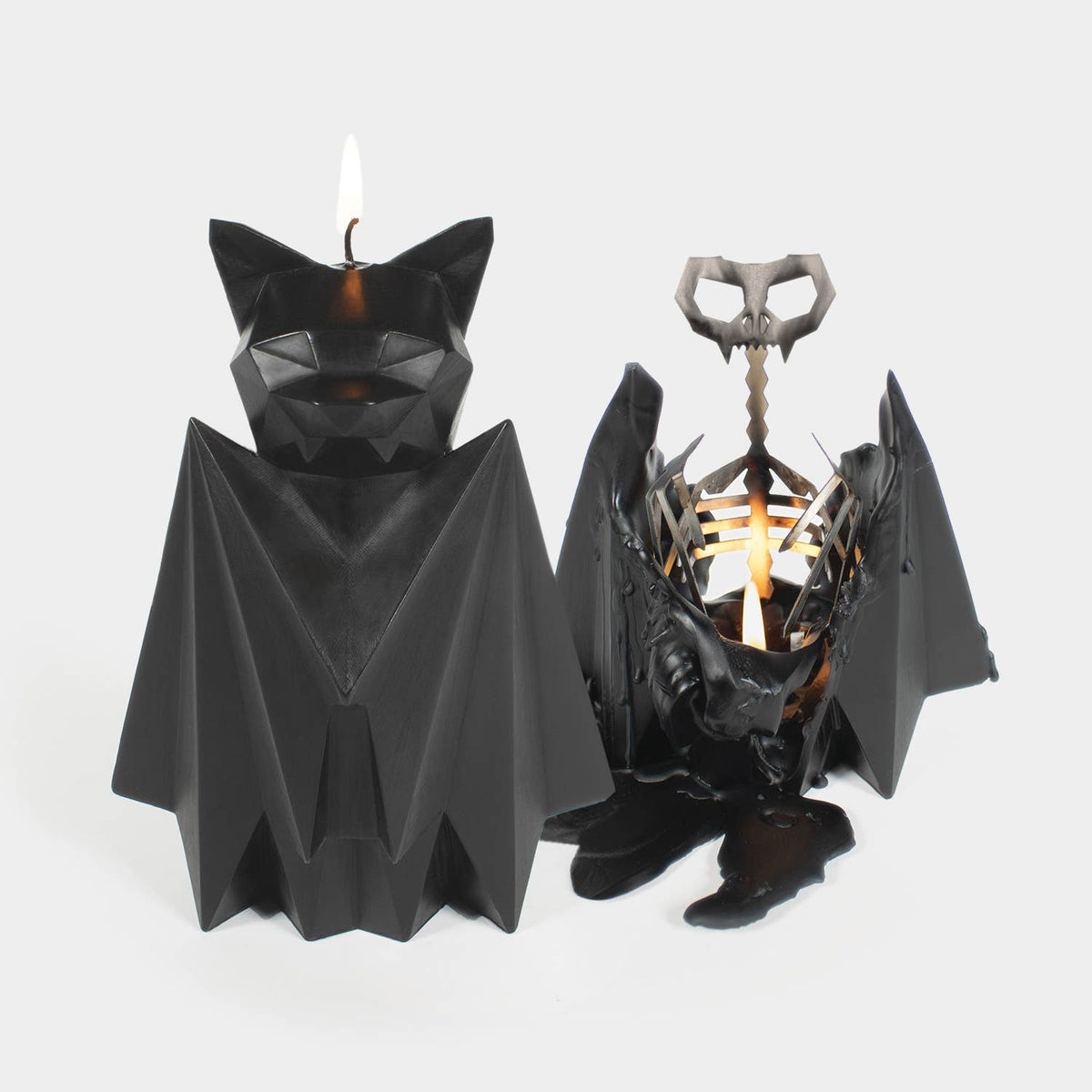 PyroPet Blaka black bat candle beside the same candle burned down to its winged metal skeleton