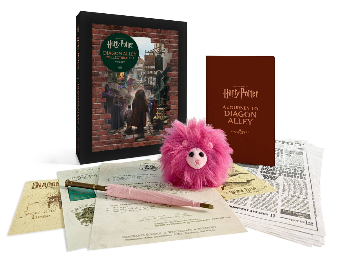 Harry Potter Diagon Alley set: a fluffy pink Pygmy Puff plush, Hagrid's pink umbrella pen, a map and Daily Prophet sheets in front of a dark keepsake box