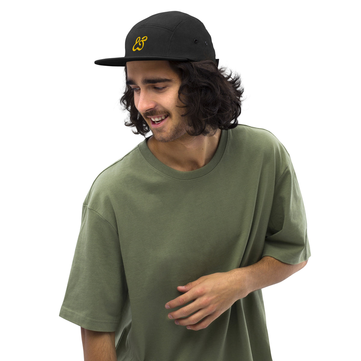 Front view of the black Moss and Fog five panel cap with its gold embroidered ampersand