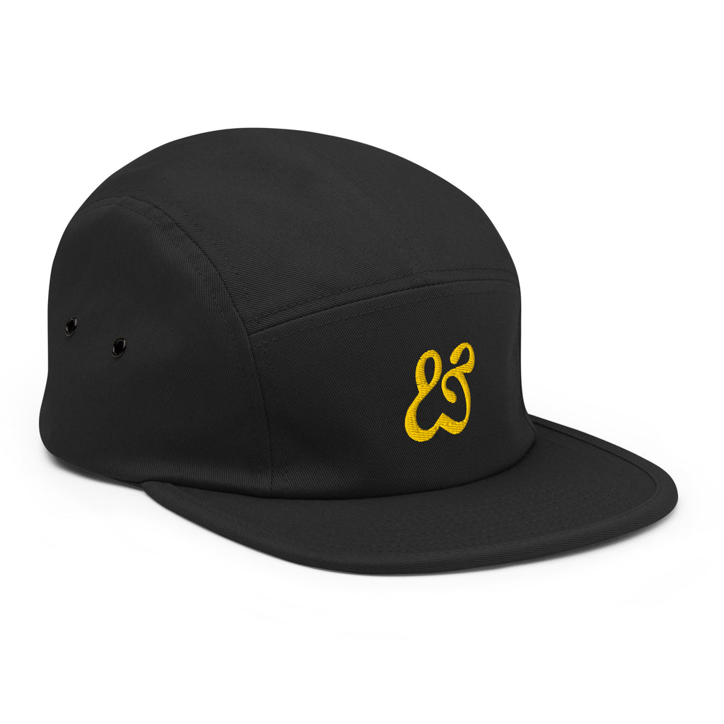 Three quarter view of the black Moss and Fog cap from the right, gold ampersand visible on the front
