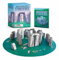 Build Your Own Stonehenge kit: a ring of small grey stones standing on a round green map, with the box and a blue illustrated guide behind