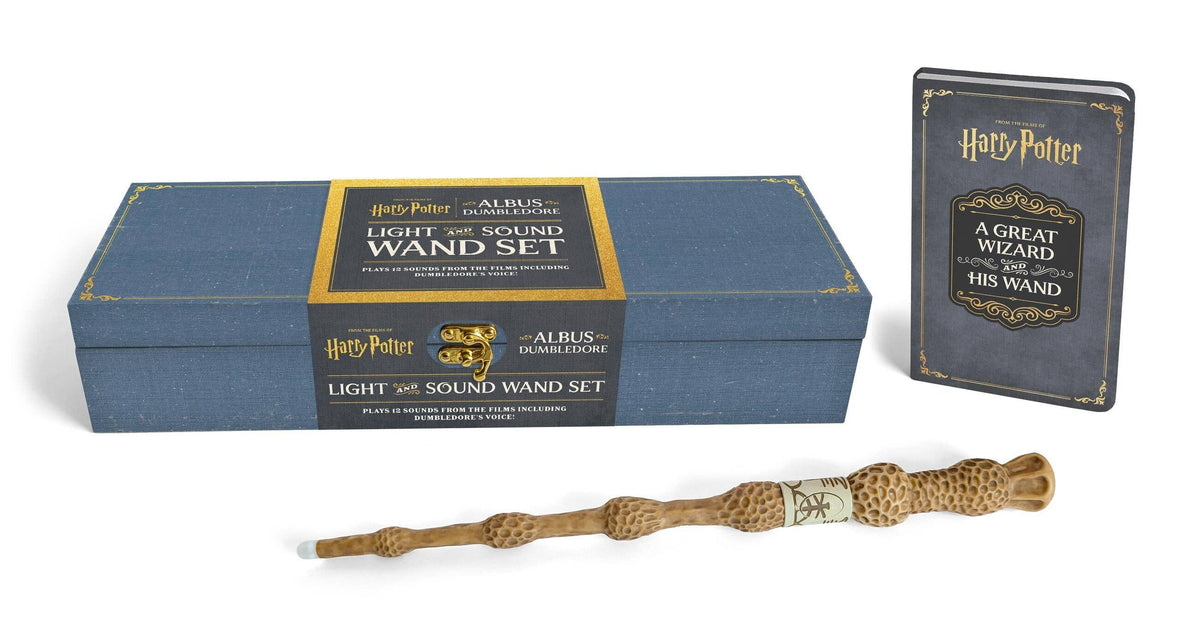 Albus Dumbledore Light and Sound Wand Set: the pale knobbled Elder Wand replica in front of a slate blue keepsake case and a small grey hardcover guidebook