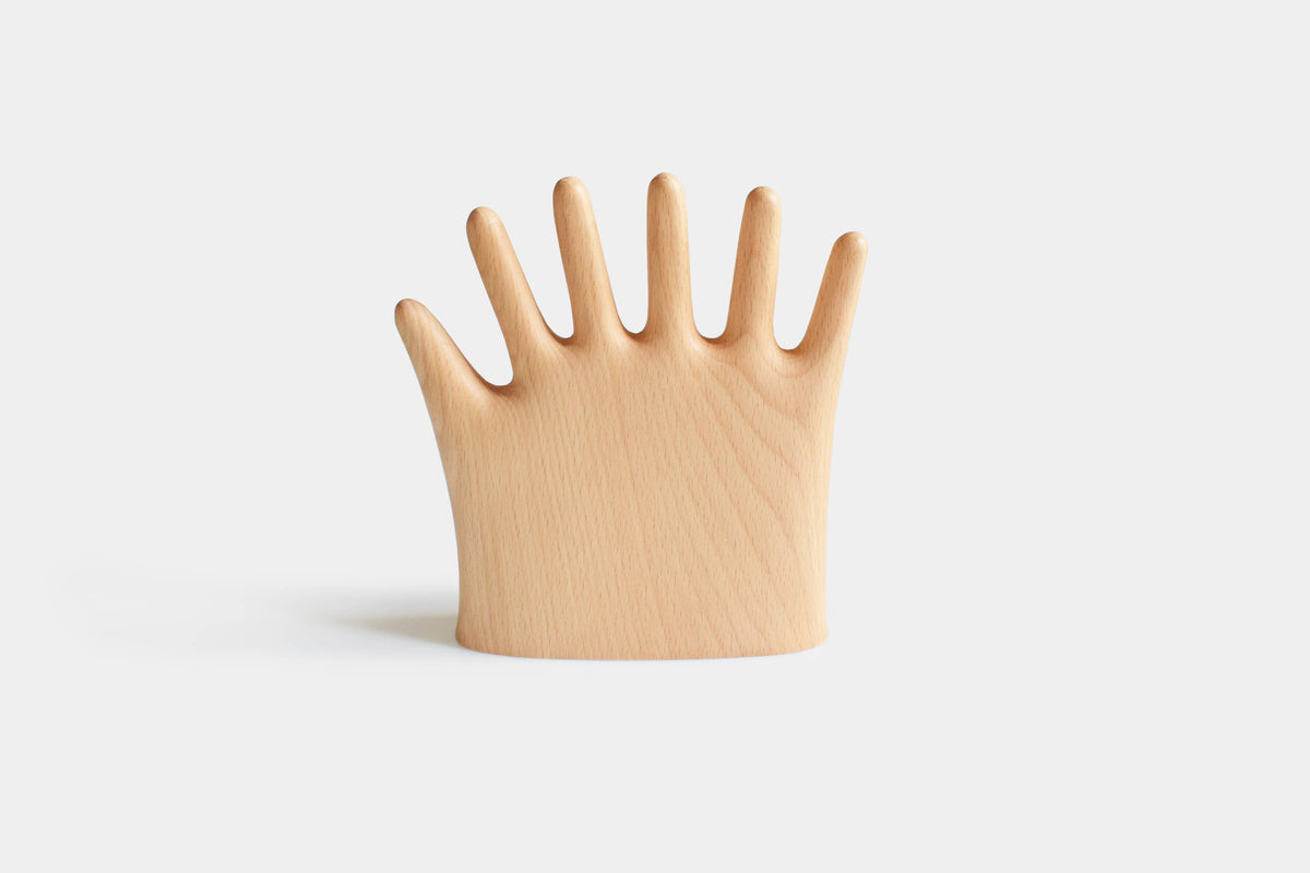 More Fingers jewelry stand in pale beech, an open hand with six fingers, front view on white