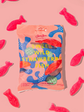 BonBon Sweet Wild Strawberry Fish bag in pink and blue on a pink ground with red candy fish