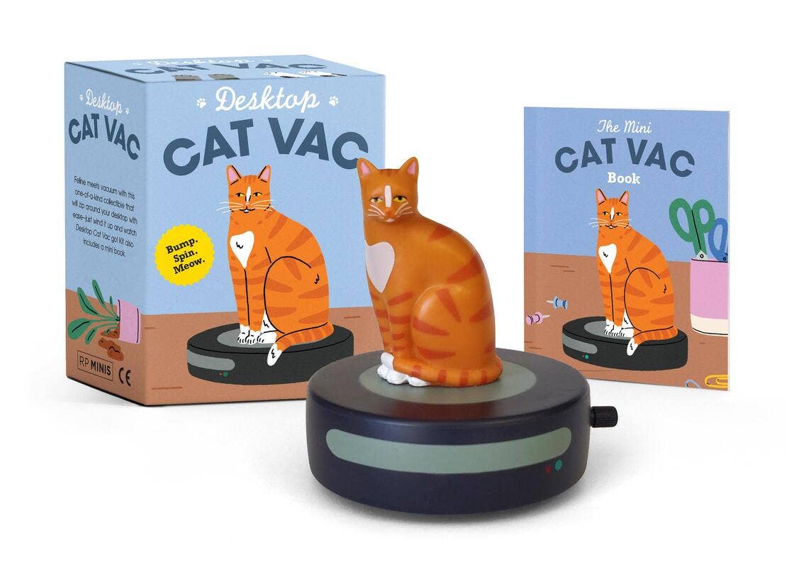 Desktop Cat Vac, a miniature cat riding a round robot vacuum