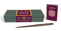 Hermione Granger Light and Sound Wand Set: a carved brown vine wand replica in front of a deep green keepsake case and a small plum hardcover guidebook