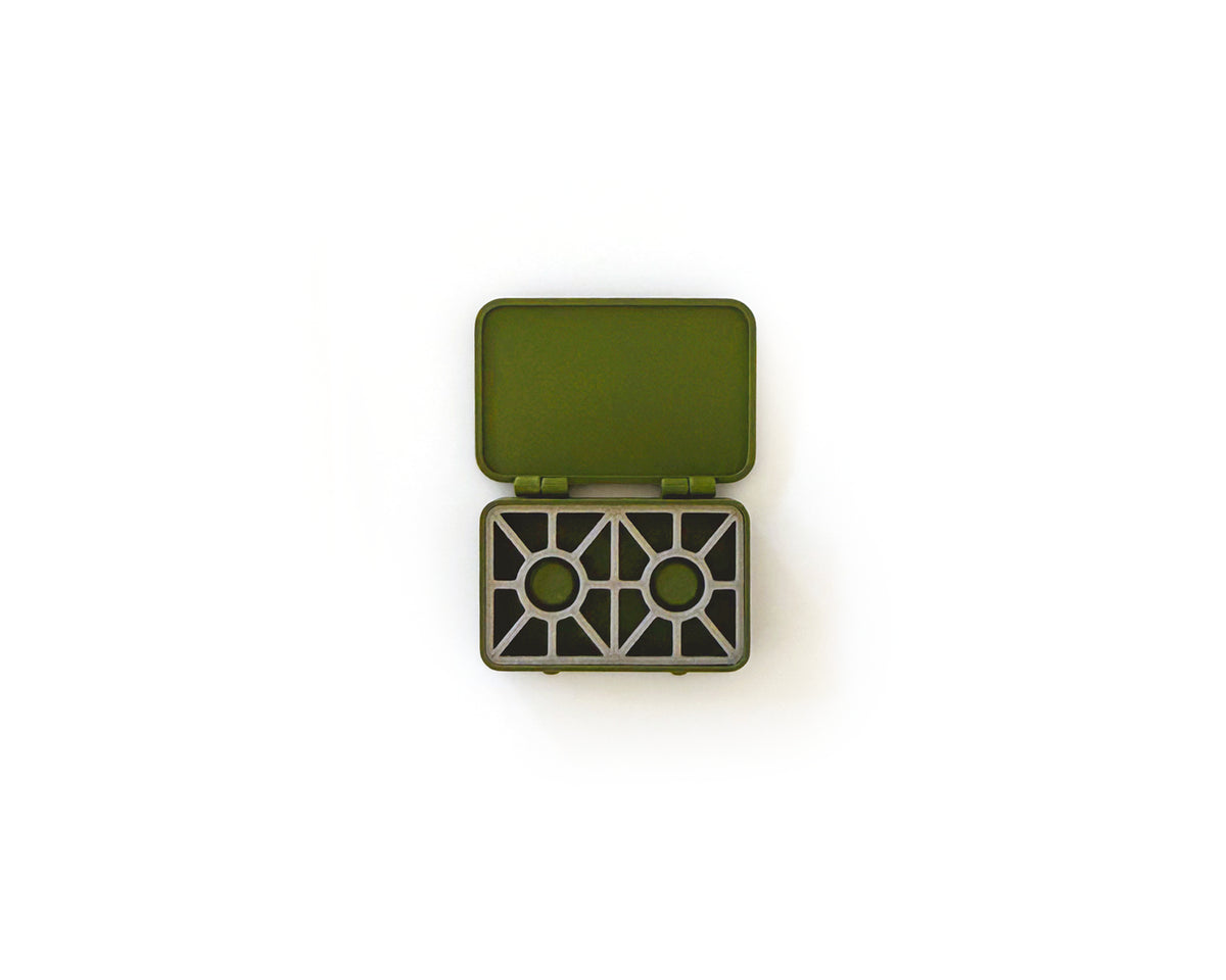 Miniature olive two burner camp stove with its lid open, from the 15 piece camping set