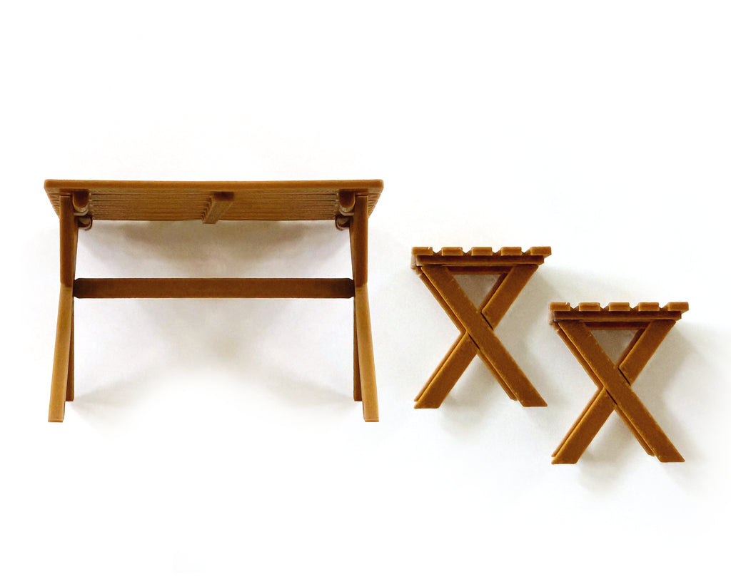 Miniature folding camp table and two X frame camp stools in warm wood tone, from the 15 piece camping set