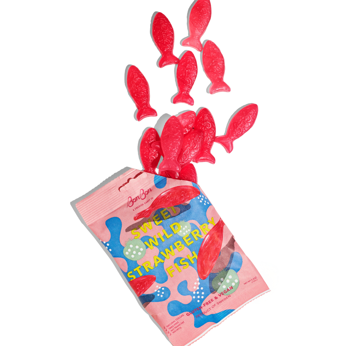 Soft red candy fish tumbling out of a BonBon Sweet Wild Strawberry Fish bag