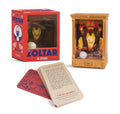 Mini Zoltar box beside the gold fortune teller booth and a fan of printed fortune cards