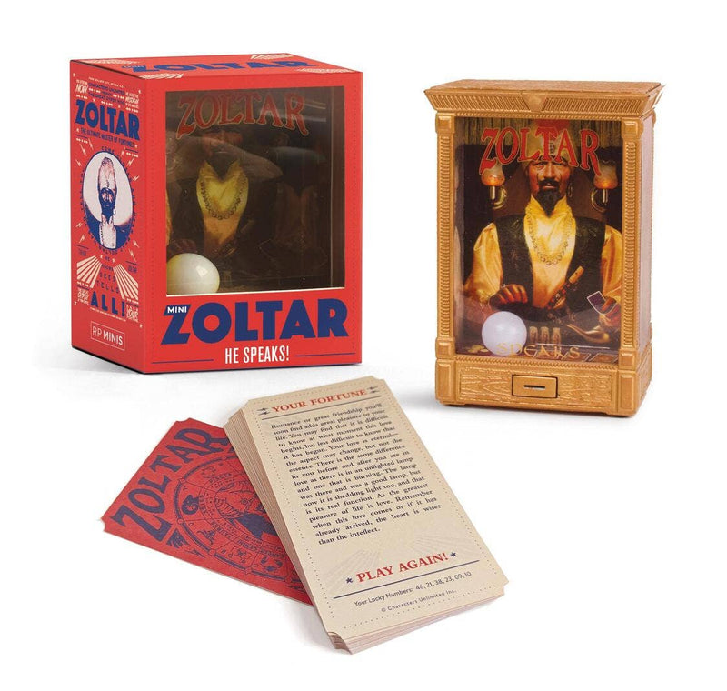 Mini Zoltar box beside the gold fortune teller booth and a fan of printed fortune cards