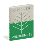 Kinfolk Wilderness cover: a pale grey linen upper half and a green lower half, with a simple white line drawing of a branching tree across both