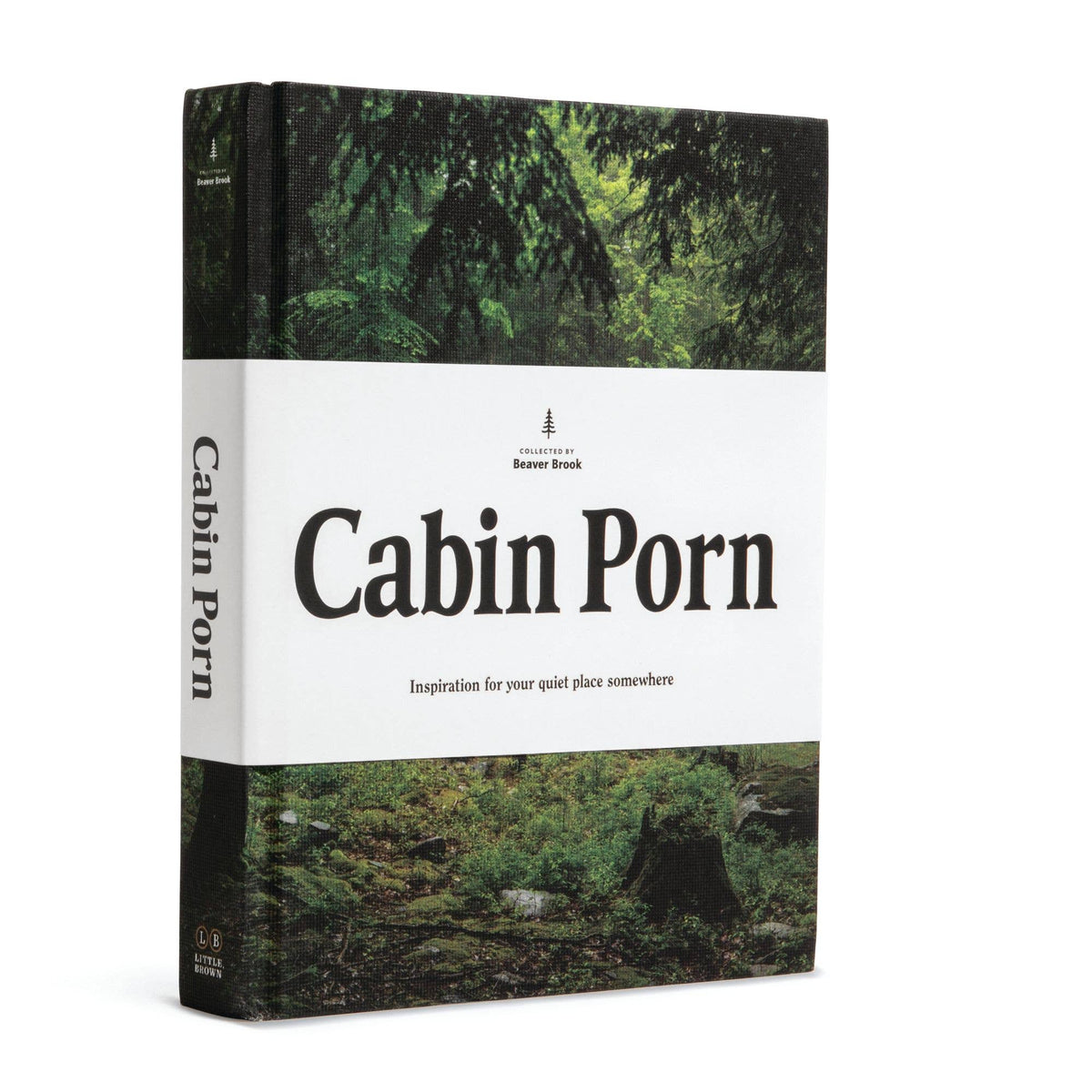 Cabin Porn hardcover standing upright, white title band over a photograph of a forest cabin