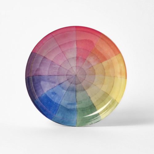 Round enamel tray printed with a soft rainbow colour wheel divided into twelve segments