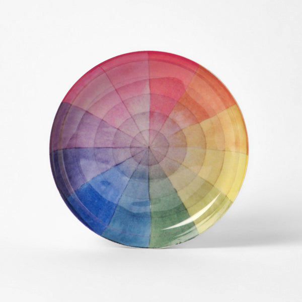 Round enamel tray printed with a soft rainbow colour wheel divided into twelve segments