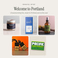 Welcome to Portland gift box from Moss & Fog: Jacobsen cherrywood smoked salt, Moonstruck dark chocolate, Mossy Walls room spray, Wild Country car freshener and a Draplin Pacific Northwest decal